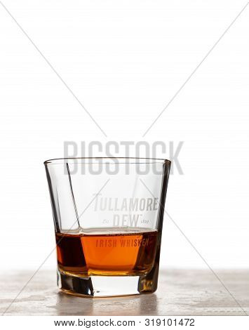 Chisinau, Moldova - August 20, 2019: Tullamore Dew Whiskey In A Glass With A Company Logo. Tullamore