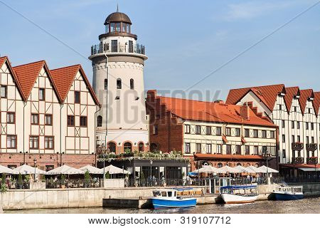 Kaliningrad, Russia - August 24, 2019: View Of The Fish Village And Lighthouse On The Embankment Of 