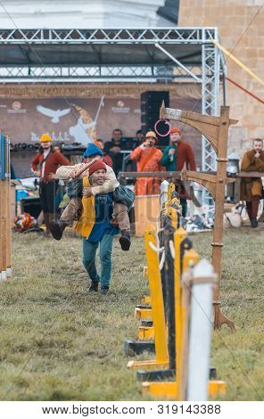 Bulgar, Russia 11-08-2019: Two Buffoons Having Fun On The Battlefield On Medieval Festival - One Man