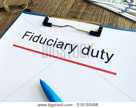 Paper With Text Fiduciary Duty On Wood Table.
