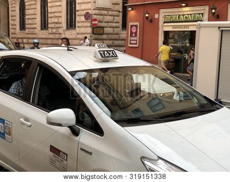 August 2019 Rome, Italy: Taxi Car And Sign In The Street