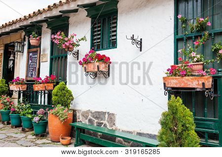 Duitama, Colombia - August, 2019: Beautiful Facades Of The Houses At The Touristic Place Called Pueb
