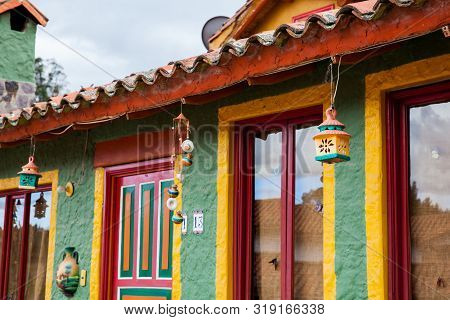 Duitama, Colombia - August, 2019: Beautiful Facades Of The Houses At The Touristic Place Called Pueb