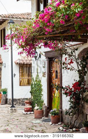 Duitama, Colombia - August, 2019: Beautiful Facades Of The Houses At The Touristic Place Called Pueb