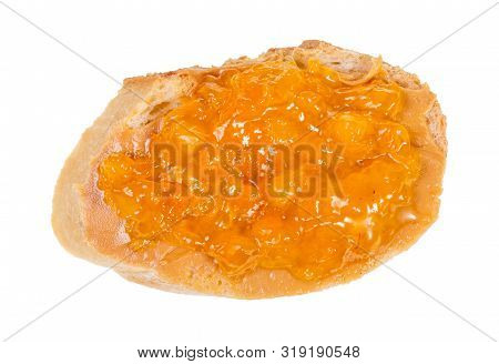 Top View Of Open Sandwich With Fresh Bread And Apricot Jam Isolated On White Background