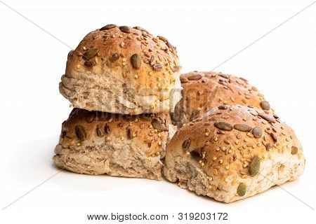 Wholemeal  Multiseeds Batch Rolls Isolated On White Batch Of Four