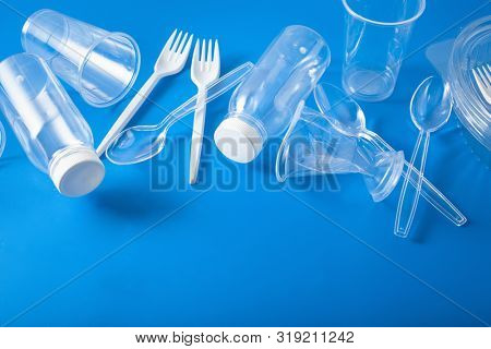 single use plastic bottles, cups, forks, spoons. concept of recycling plastic, plastic waste