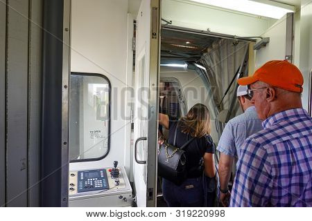 Orlando, Fl/usa-8/22/19: People Waiting On A Jetway To Board An Airplane.