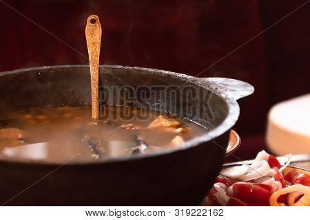 Fish Soup. Cooking Delicious Soup In A Large Cauldron.
