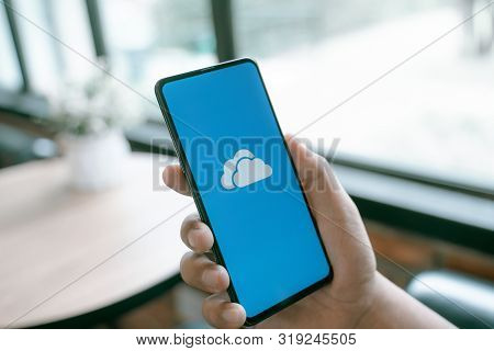 Chiang Mai, Thailand - Aug.24,2019: Man Holding Xiaomi Mi Mix 3 With Onedrive On Screen. Microsoft O