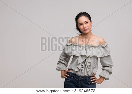 Beautiful Asian Woman In Grey Shirt Standing And Is Posing Wai, It Is The Thai Traditional, Isolated