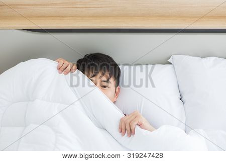 Close Up Shot Of Asian Handsome Man Lying On Comfort Bed, He Slept Deep In Bedroom.