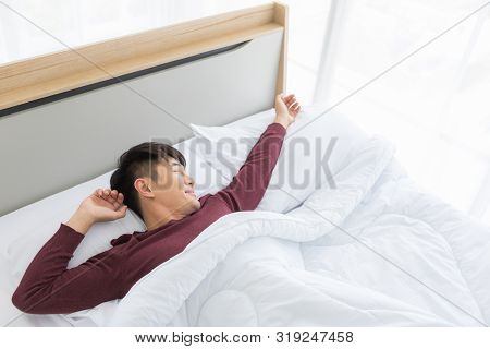 Close Up Shot Of Asian Handsome Man Lying On Comfort Bed, He Slept Deep In Bedroom.