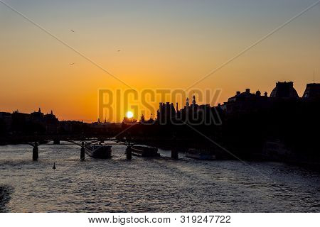 Sunset Over Seine River And Pont Des Arts With Palais Royal And Musee Dorsay In Background - Paris, 