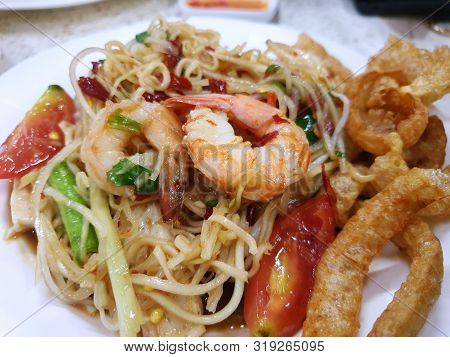 Thai Food Style, Selective Focus Of Papaya Salad And Pork Crackling In Restaurant, This Food Is Most