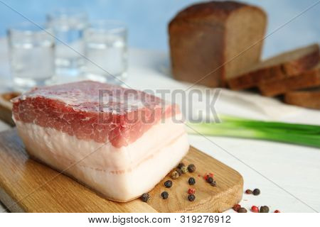 Composition With Pork Fatback On White Table. Space For Text