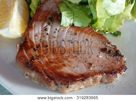 Tuna steak grilled sea food with lemon