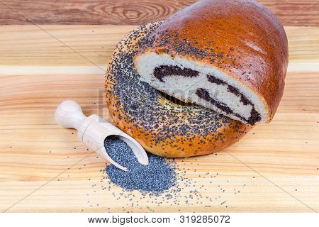 Raw Blue Poppy Seeds In The Special Wooden Spice Spoon And Scattered Beside Her, Pie With Sweet Crus