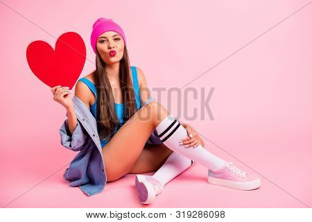 Full Size Photo Of Charming Lady Sending Air Kisses Dating Holding Papercard Heart Wearing Blue Body