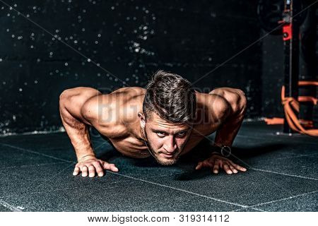 Pus Ups Workout, Strong Young Toned Muscular Fitness Man Push Ups Workout Training On The Gym Floor