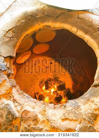 Tandoor With Round Flatbread . The Word Tandoor Means A Cylindrical Oven Used For Baking And Cooking