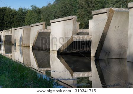 Waterloopbos, The Netherlands, August 25, 2019: The Concrete National Monument, Reflecting In The Su