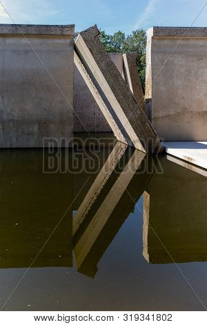 Waterloopbos, The Netherlands, August 25, 2019: The Concrete National Monument, Reflecting In The Su