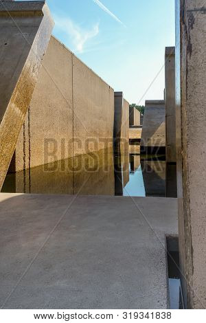 Waterloopbos, The Netherlands, August 25, 2019: The Concrete National Monument, Reflecting In The Su