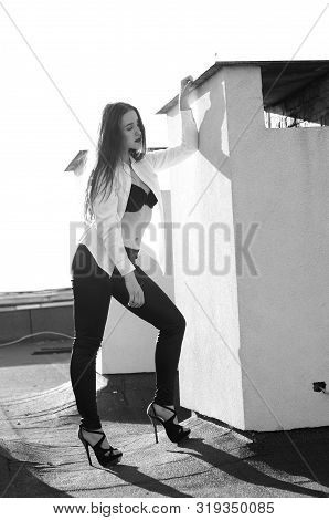Young Sexy Woman Posing In The Roof, Wearing Leater Jacket, Swag Floral Hat Mirrored Sunglasses And 