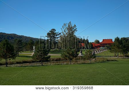 Harrington, Qc, Canada - September 23, 2018: Tourists At The Tam Bao Son Buddhist Temple In Quebec D
