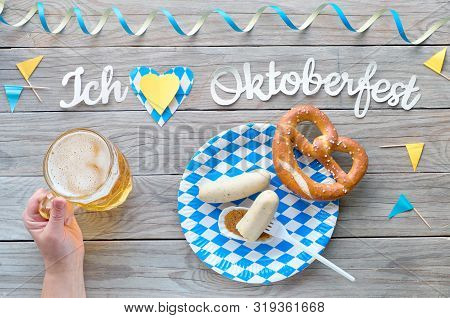 Oktoberfest, Traditional Festival Food: White Sausages, Pretzel And Beer. Flat Lay On Rustic Wooden 