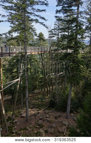 Bad Wildbad, Germany - April 22, 2019: Narrow Pedestrian Walkway Made Of Wood And Metal Mesh In The 