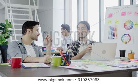 Group Young Coworkers Together Discussing Creative Project During Work Process Modern Colleagues In 