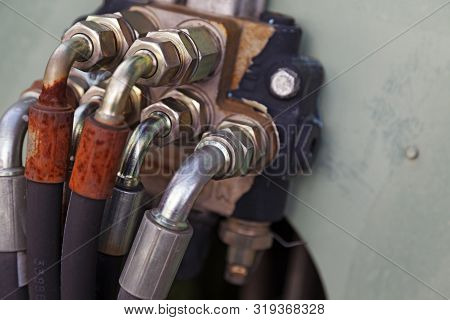 Several Hoses Mounted With Silver-colored Bolts Are Used For Hydraulics