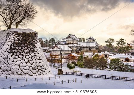 Kanazawa, Japan at the castle in winter with snow.