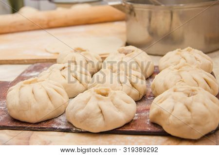 Vak Belyash - Bashkir National Cuisine, Homemade Meat Pies In White Bowl Over Wooden Background