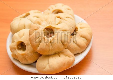 Vak Belyash - Bashkir National Cuisine, Homemade Meat Pies In White Bowl Over Wooden Background