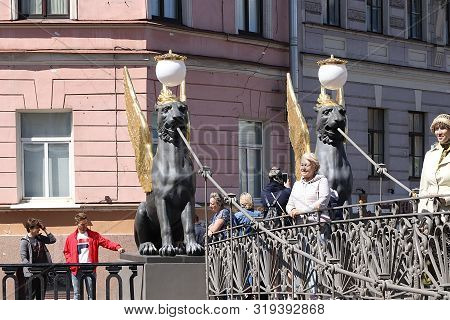 Russia, Petersburg, June 29, 2019. Winged Lions On The Bank Bridge. Griffins On The Banks Of The Bri