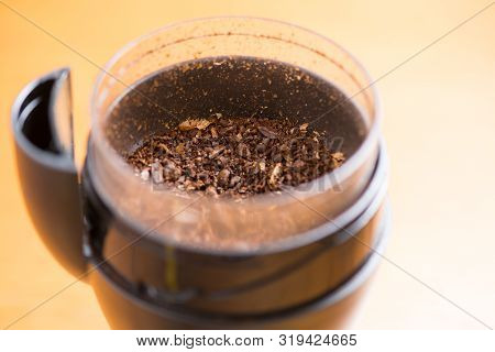 Coffee Beans Are Ground Into Coffee Powder By A Grinder
