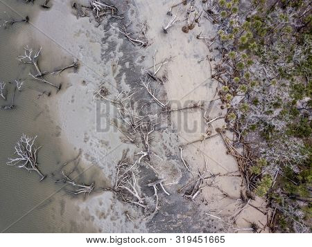 Aerial straight down view of hurricane damage and eroded beach in South Carolina.