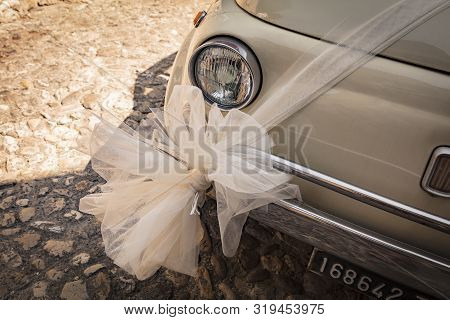 Malcesine, Lake Garda, Italy, August 2019, A Wedding Decoration On A Fiat 500 Bonnet