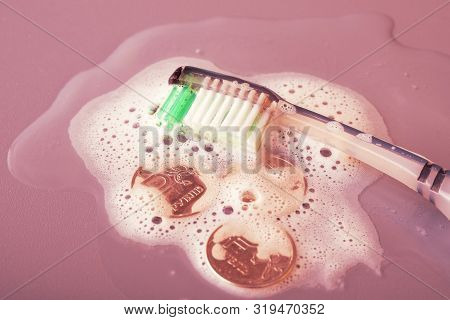 Tooth Cheek And Coins Lying In The Foam Tinted Red. Small Money Is Required For Cleaning Teeth Do No