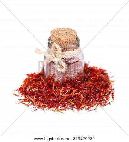 Pile Of Saffron In Glass Jar, Isolated On White Background. Dried Saffron Spice.