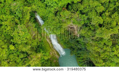 Mantayupan Falls In The Jungle, Island Of Cebu, Philippines. Waterfall In The Green Forest.