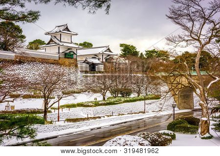 Kanazawa, Japan at the castle in winter with snow.
