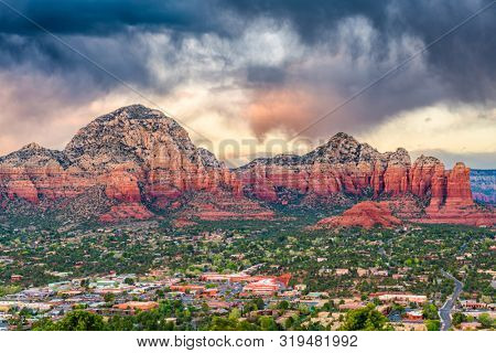 Sedona, Arizona, USA downtown cityscape and mountains.
