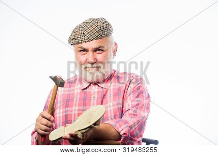 Mature Shoemaker In Workshop Make Shoes. Shoemaker At Work. Retro Man Repair Shoes With Hammer. Cobb