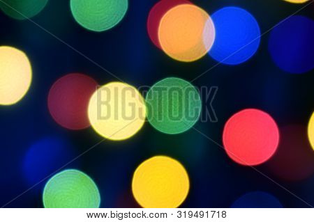 Blue Christmas Bokeh With Light Beautifully Little Lights. Blurred Background. Place For Your Text, 