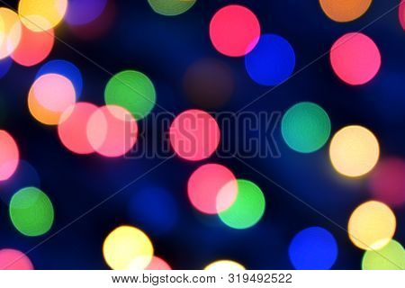 Blue Christmas Bokeh With Light Beautifully Little Lights. Blurred Background. Place For Your Text, 