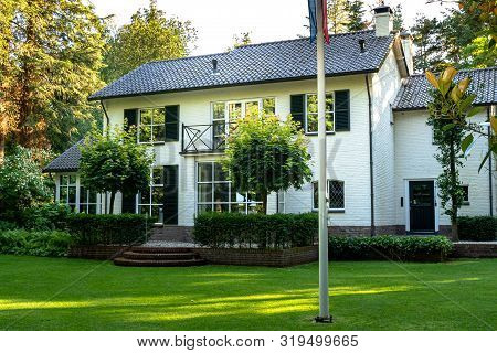 Luxury White Painted House With Archtecture Details From The Pre-war 1930s And 40s.